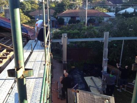 Week5: beam above kitchen wall being hoisted